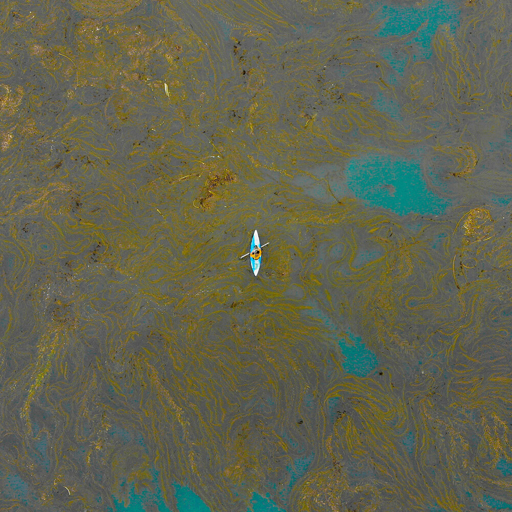 kayak in a sea of dirty water