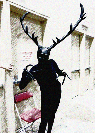 A person dressed as the wendigo character from Hannibal.